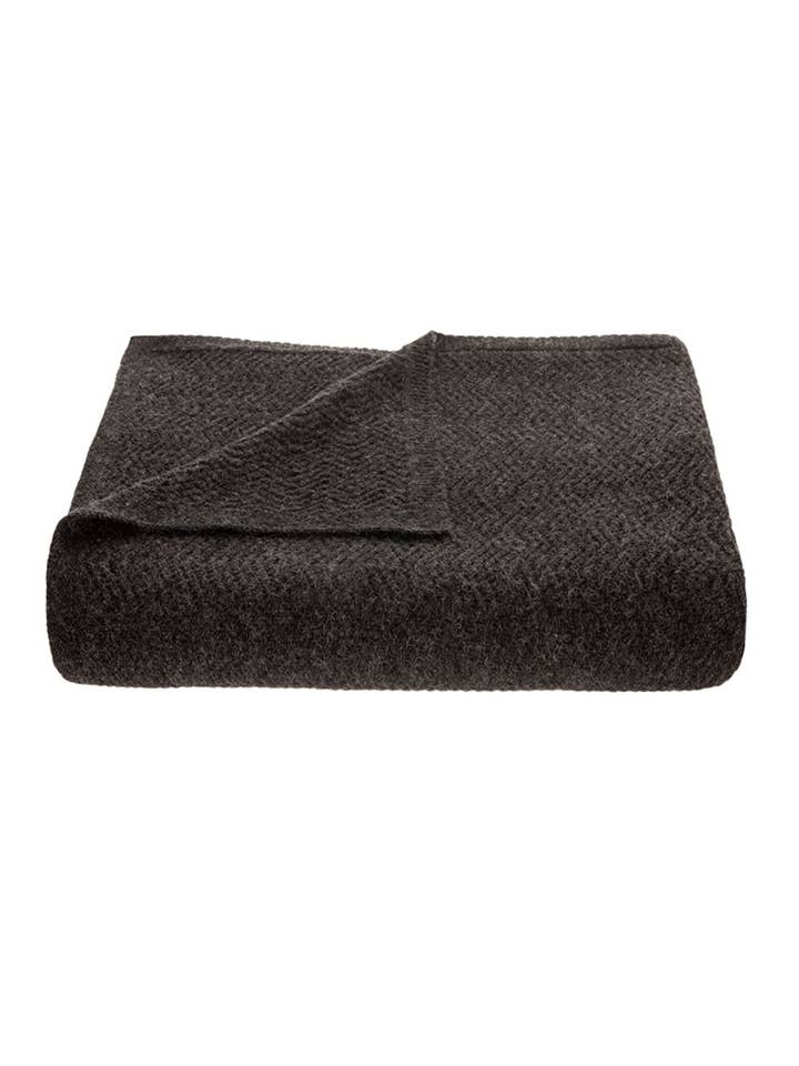 Wave Knitted Throw in Charcoal for wholesale by tuwi