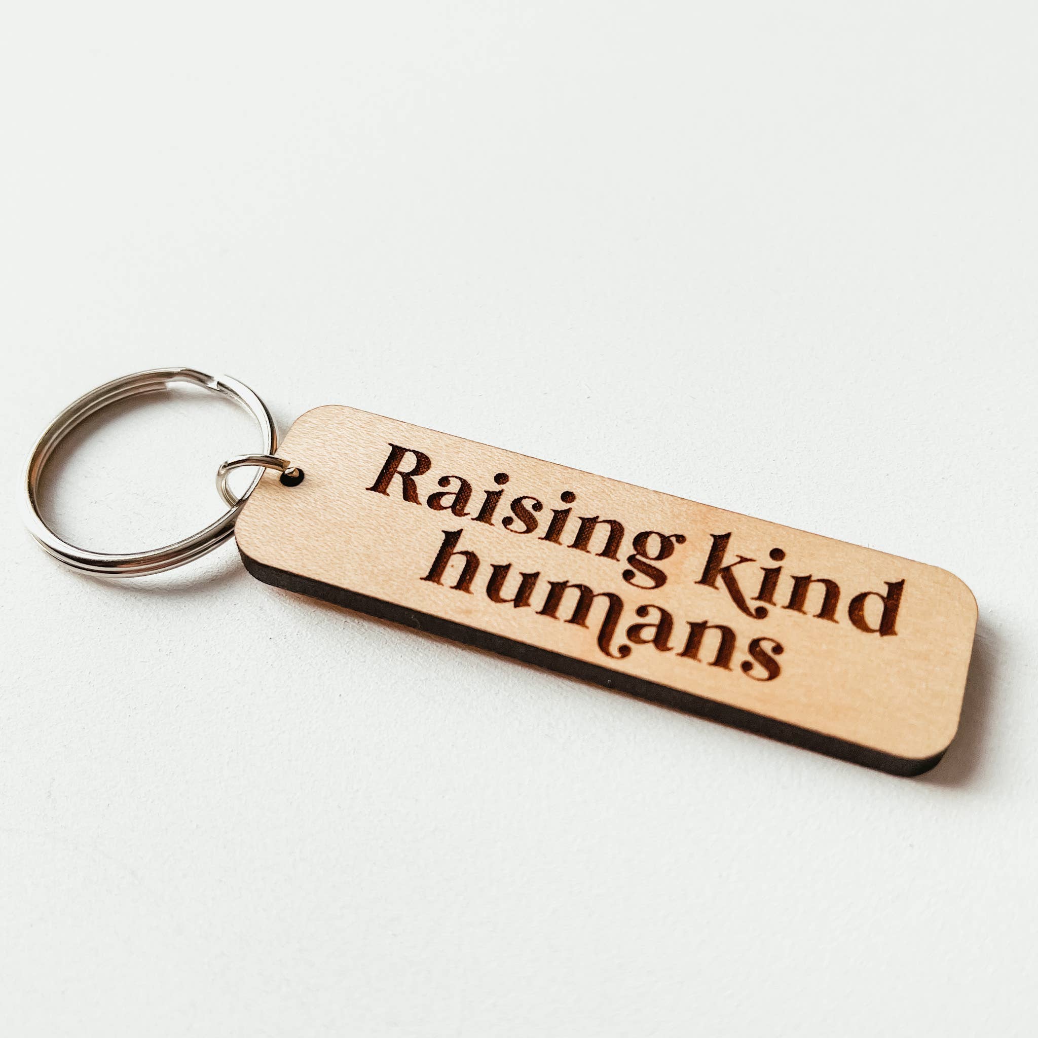 Knotty Design Co. - Wholesale Keychain - Unisex - Raising Kind Humans Wooden Keychain1