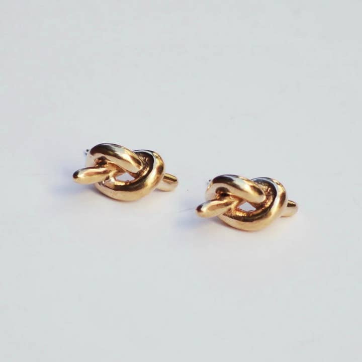 Single bronze mini knot earring for wholesale by Take Shape Studio