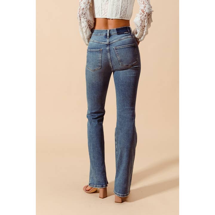 DENIM MID RISE YOKE CUT FLARE BOTTOM LONG LENGTH JEANS for wholesale on Faire