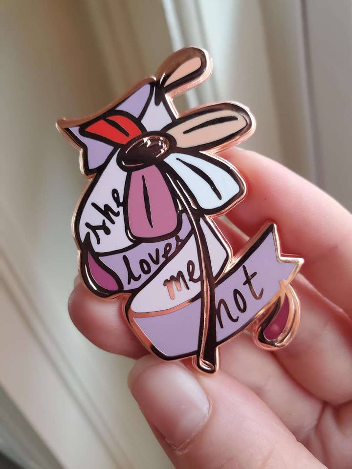She Loves Me Not - Enamel Pin for wholesale by Joan of Art