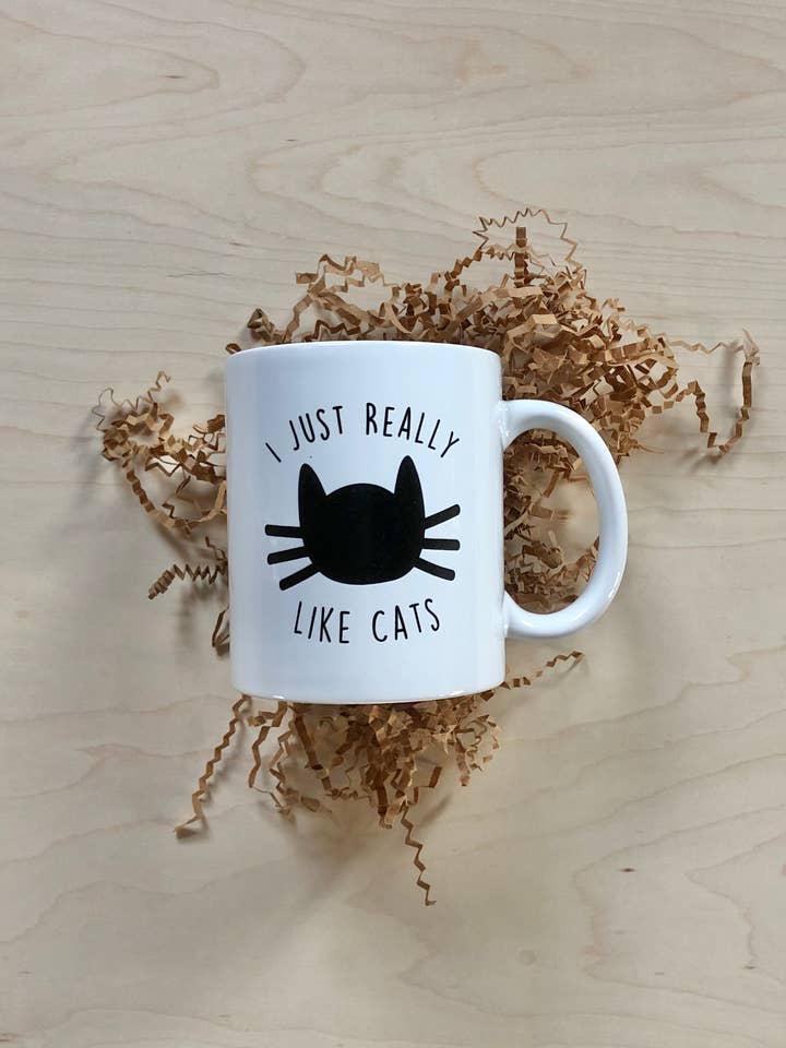 “I just really like cats” Ceramic Mug for wholesale by Breakout Press Co.