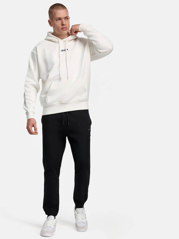 Tute sportive premium bianche nere per la vendita all'ingrosso da parte di 4BRA