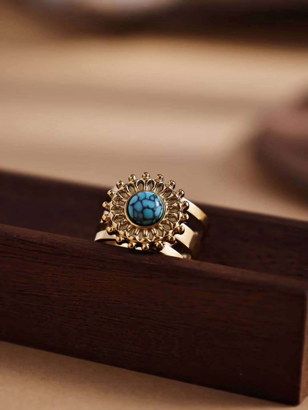 Revelari – wholesale Cocktail/statement ring – Gold Ring with Sunflower Design and Green Gemstone0