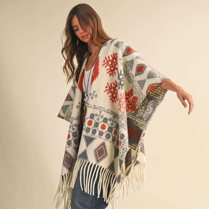 IJ1663 OVERSIZED FRINGED CAPE WITH PATTERNS and other Purchase Wholesale fringed. Free Returns & Net 60 Terms on Faire trending on Faire.