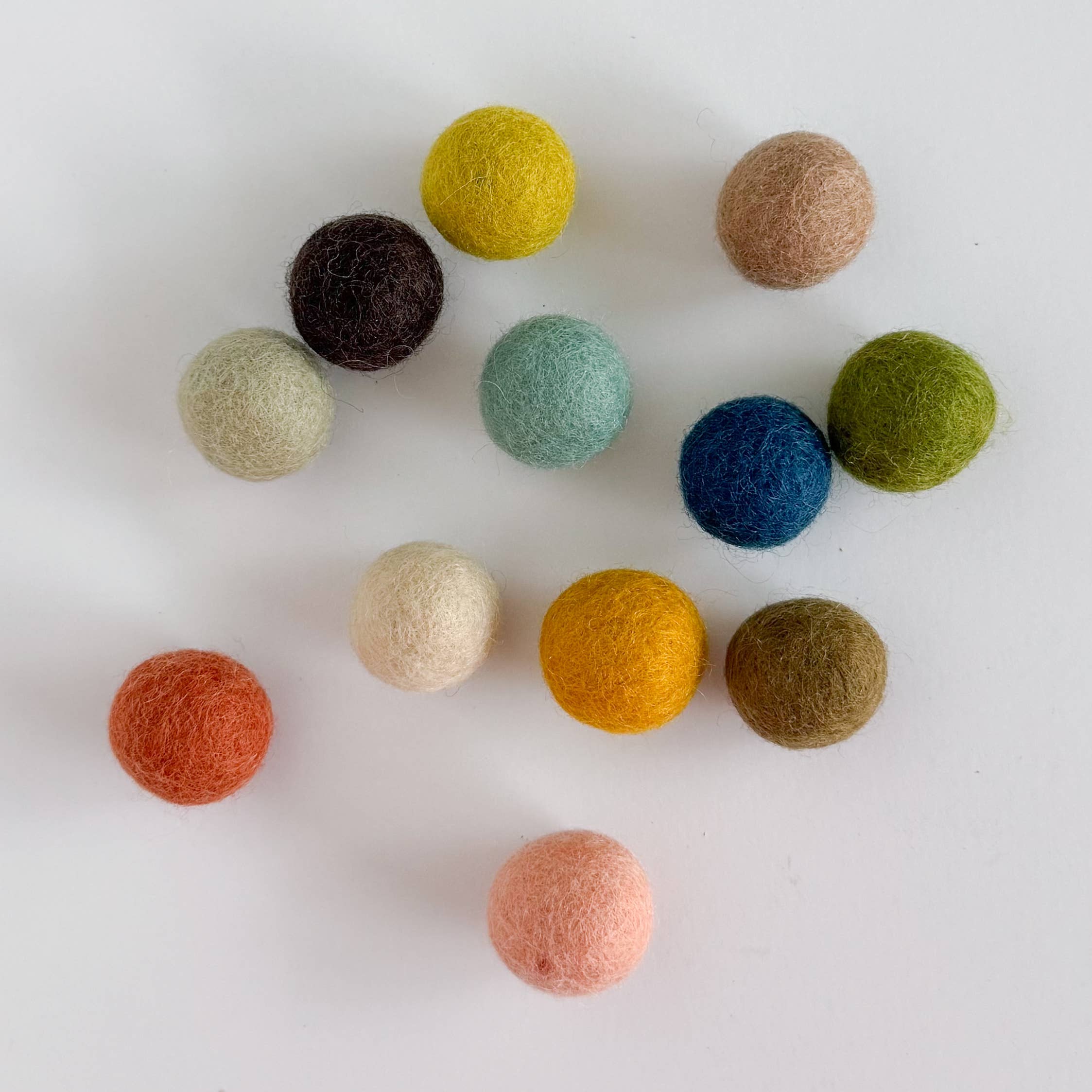 Muted Rainbow Wood Slingshot with 12 Felt Balls  for wholesale on Faire3