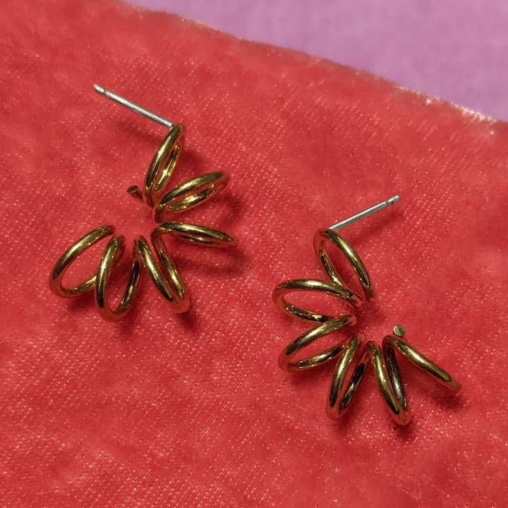 curved spiral hoops for wholesale by becca compton jewels