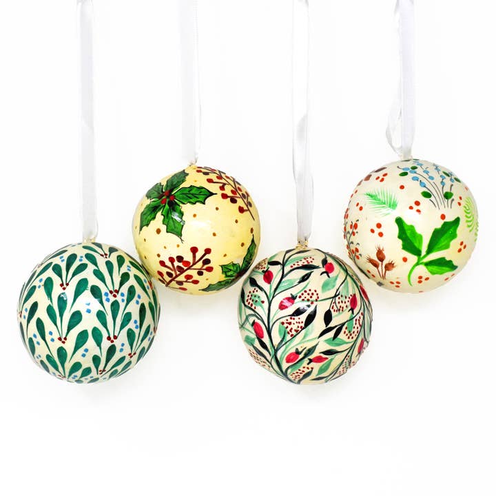 Hand painted papier mâché green winter Christmas baubles for wholesale by Fair to Trade Ltd