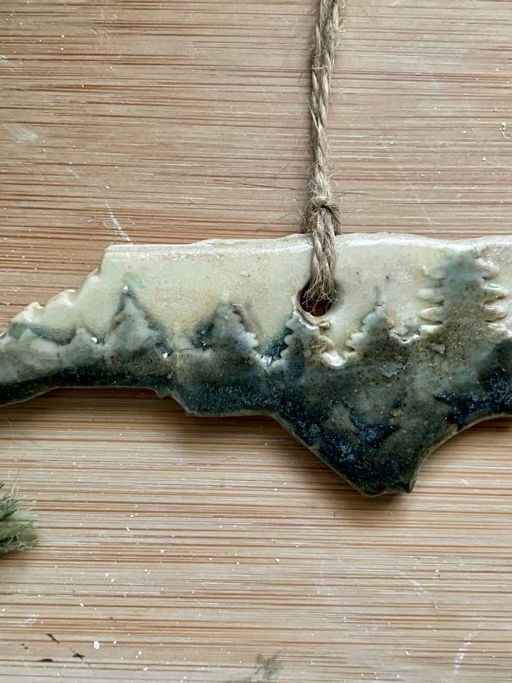 Rustic North Carolina with Trees Ceramic Ornament for wholesale by Flow Art Studios