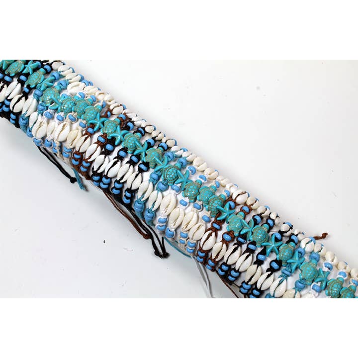 Tube Of Resin Starfish/Turtle With Cowrie Shells Wristbands for wholesale by Western Counties Wholesale