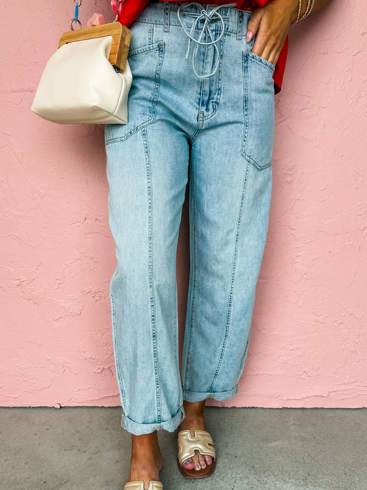 Jean à cordon de serrage avec détail de couture exposée pour la vente par FULL TIME PURCHASE