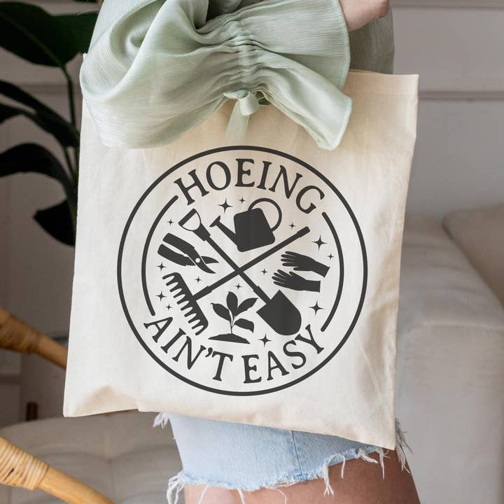 Hoeing Ain't Easy Tote Bag, Plant Gift, Garden Shop for wholesale by The Vinyl Rose