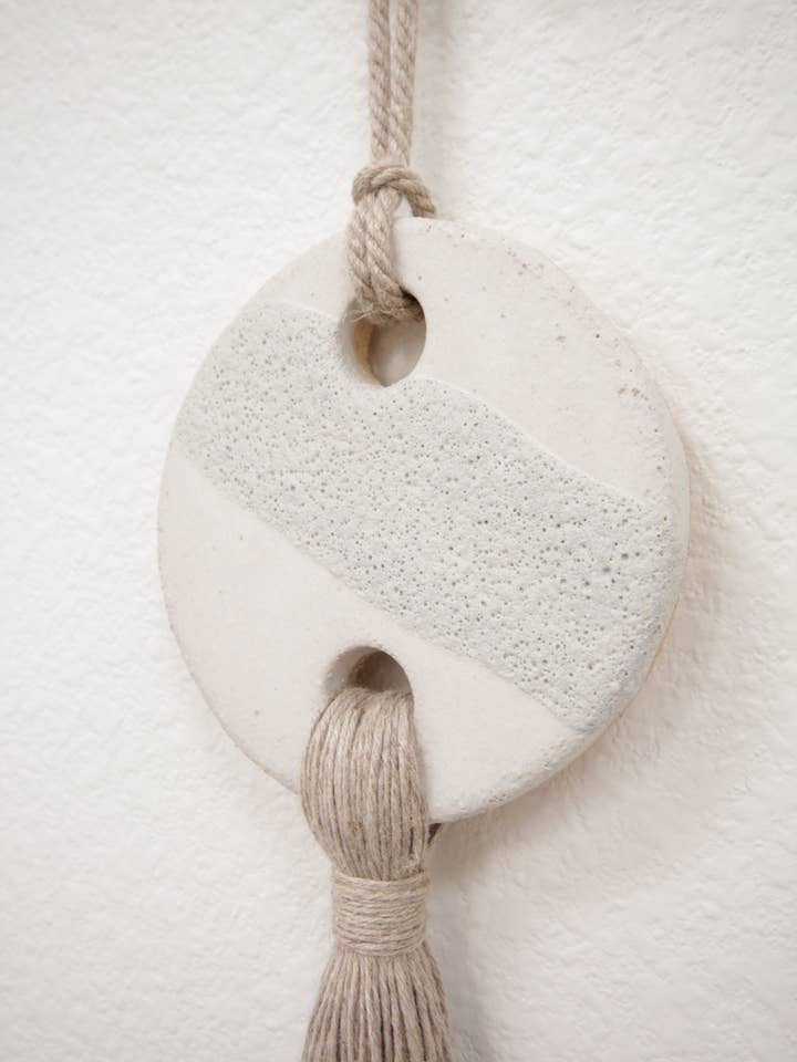 Glyph Wall Sculpture - Pluto W/ Fringe for wholesale by Fanny Penny