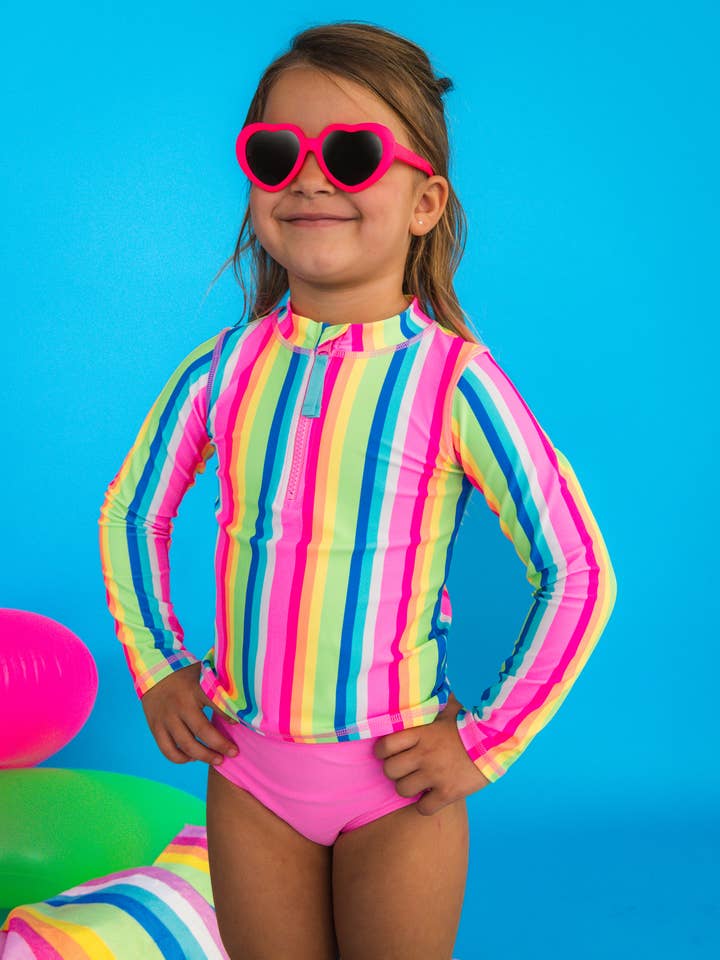 Girls Neon Rainbow Stripe Long Sleeve Zipper Rash Guard 2-Piece Swimsuit with Signature Rear Ruffles
for wholesale by RuffleButts + RuggedButts