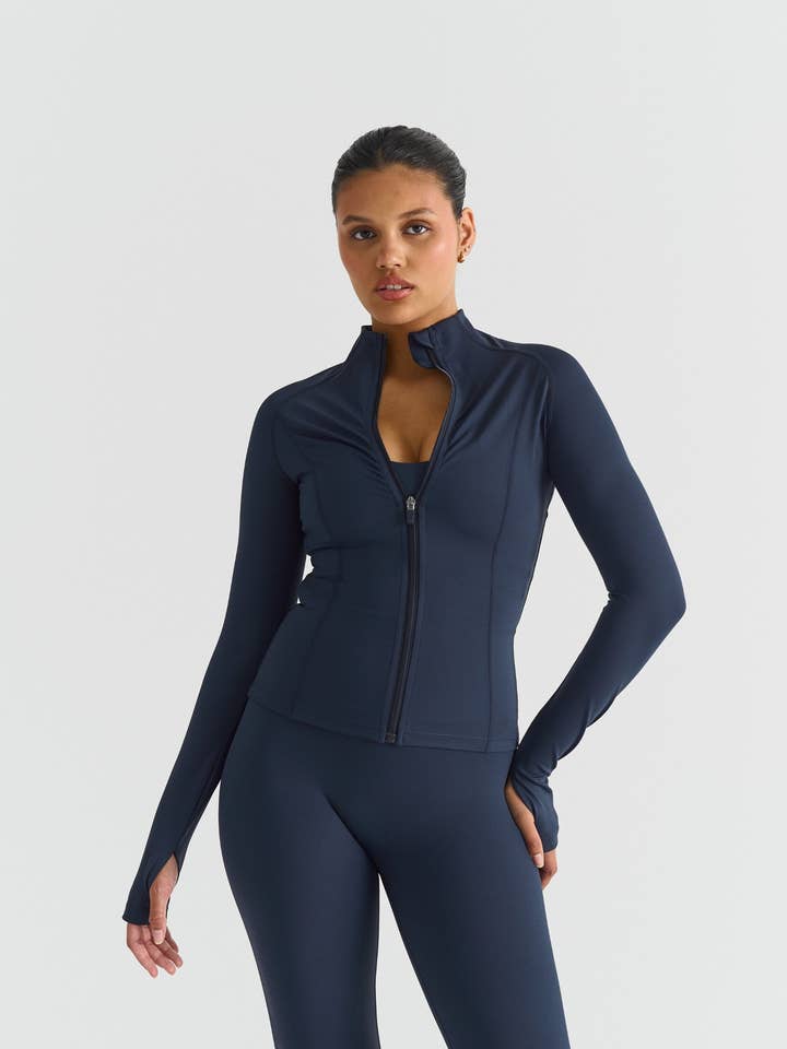 Softsculpt Zip Jacket - Navy for wholesale by Sisterly Tribe