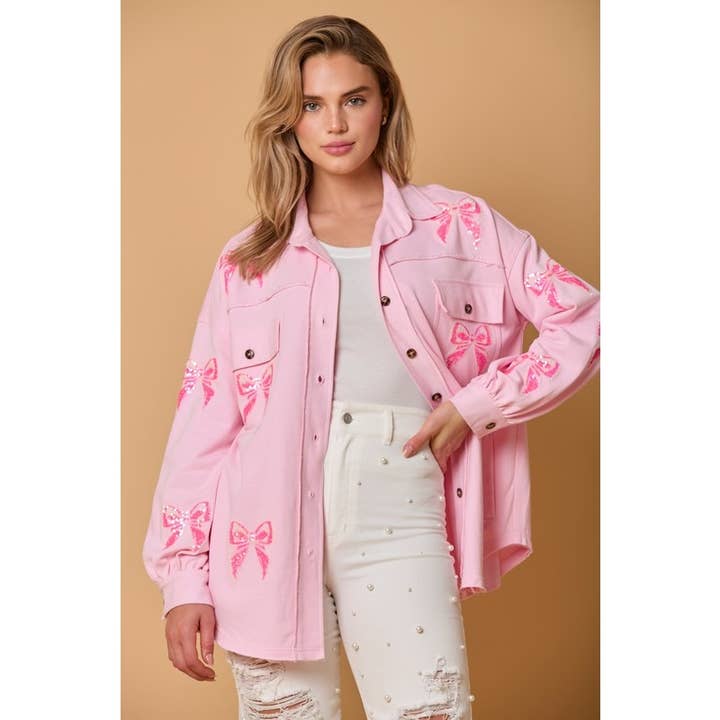 Veste en tissu éponge à sequins à nœud pour la vente par STYLE USA