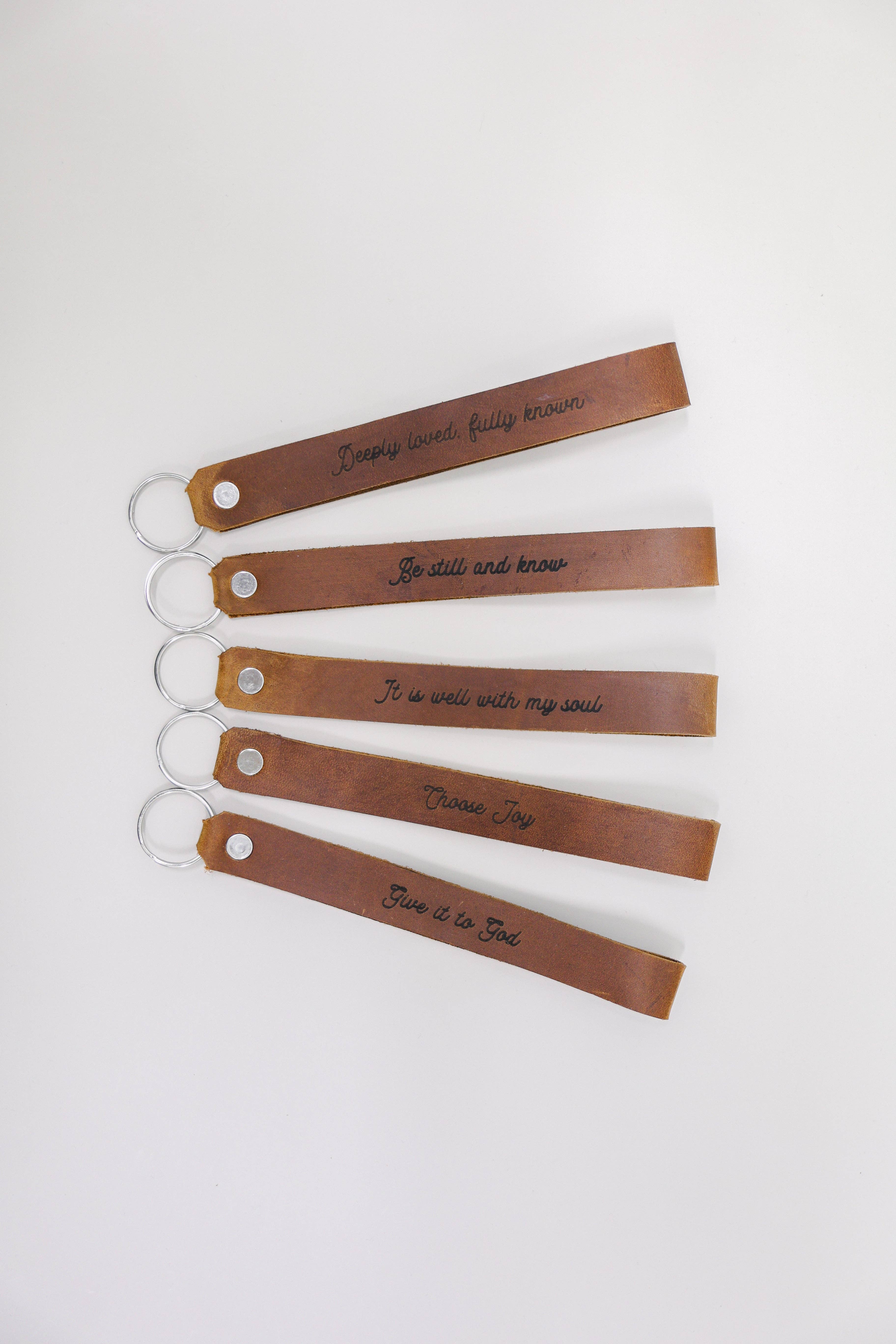 Jubilee Trading Co.  |  Ethical Trade Decor + Accessories - Wholesale Keychain - Unisex - It Is Well With My Soul Wristlet Engraved Leather7