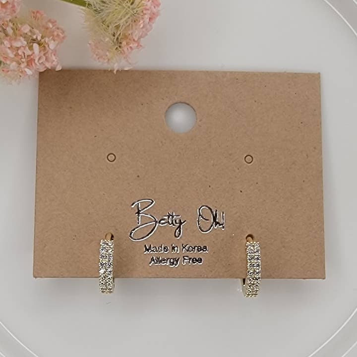 ORECCHINI CLICKER IN ZIRCONIA CUBICA. per la vendita all'ingrosso da parte di BETTYOH INC