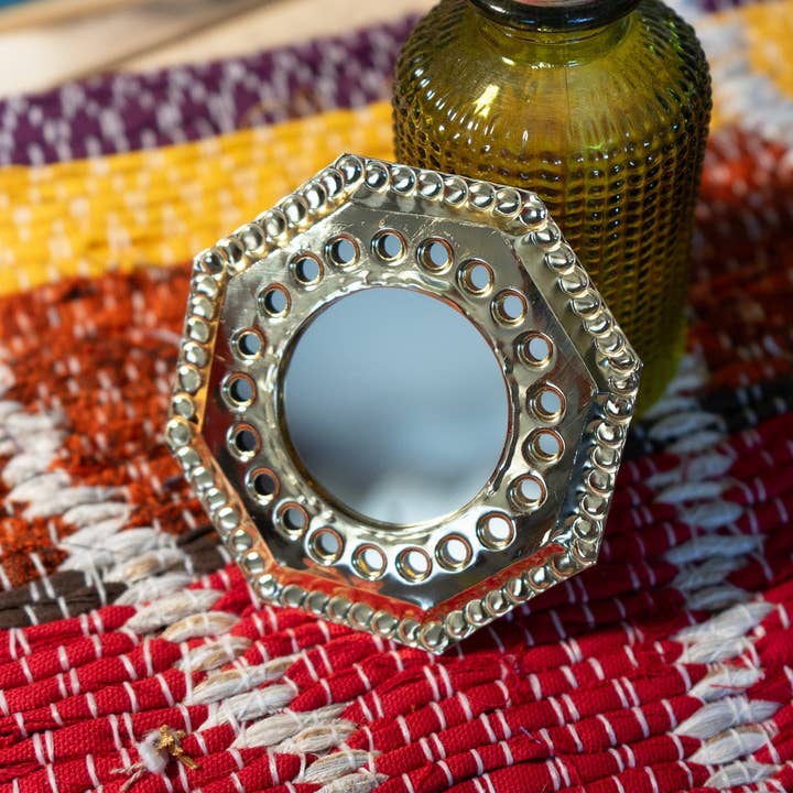 Small Moroccan brass mirror with hexagon holes for wholesale by Mamie Bohéme