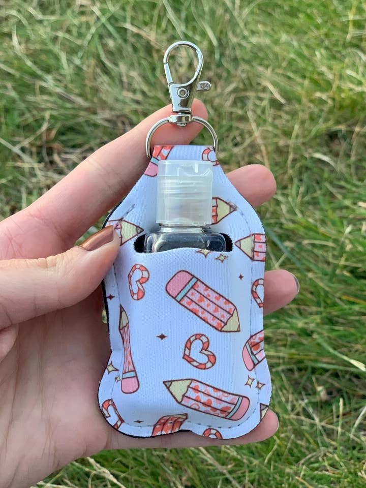 Personlig penn & hjärta handdesinfektionsmedelshållare nyckelring för wholesale av The E Tribe Co.