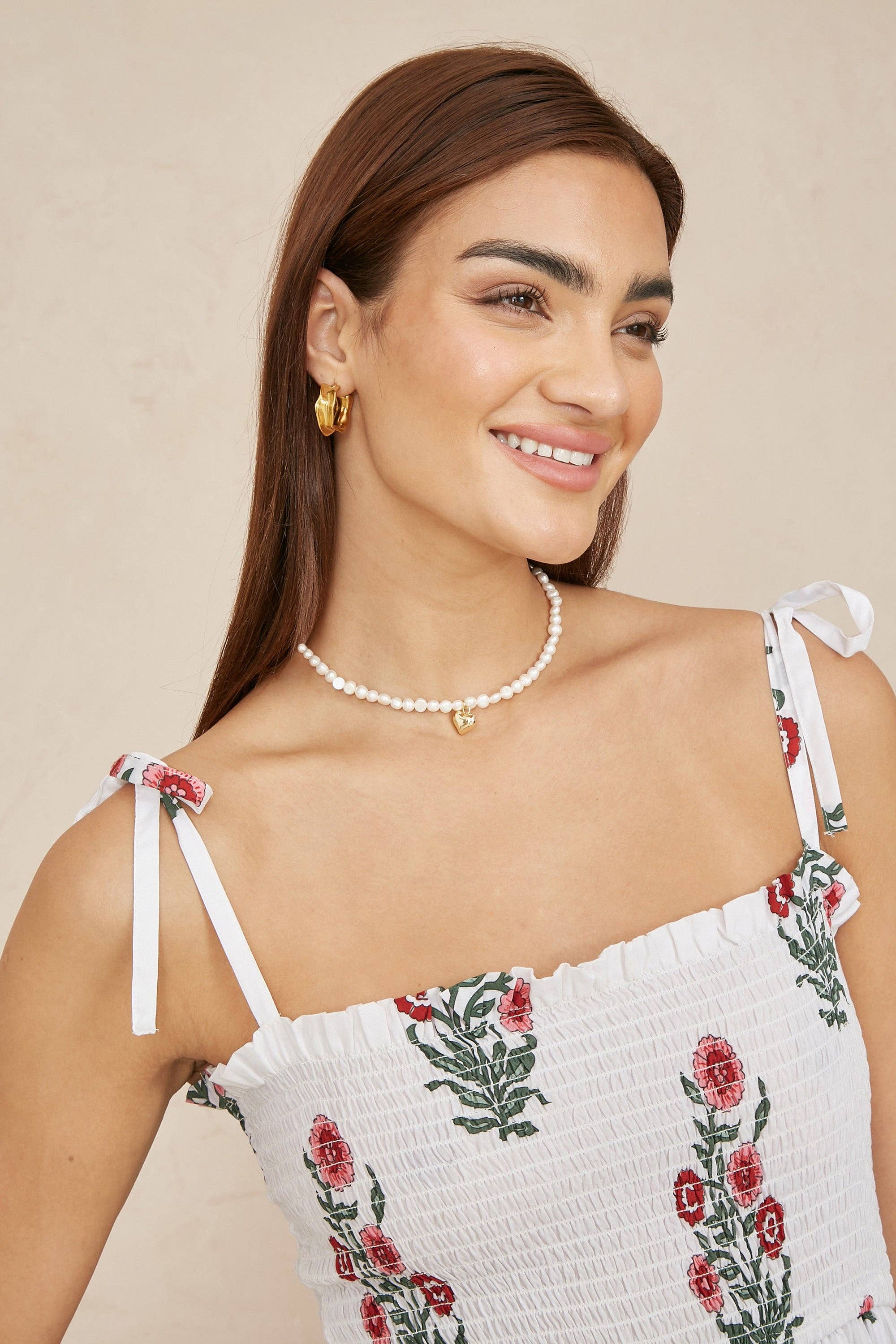 Yumi White Floral Printed Smocked Midi Dress for wholesale on Faire1