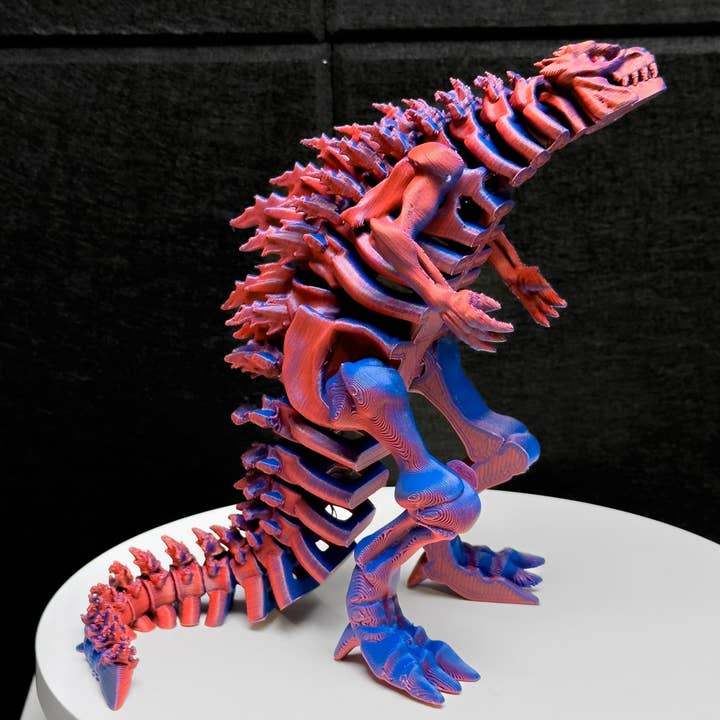 Fuldartikuleret skeletteret Godzilla 3D-effekt rød & blå figur håndlavet legetøj for engroshandel hos August Art House