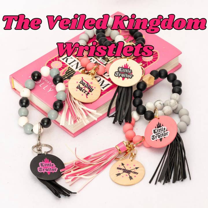 Officiellt licensierade The Veiled Kingdom handledsnyckelringar för wholesale av Dogwood + Daisy Studio