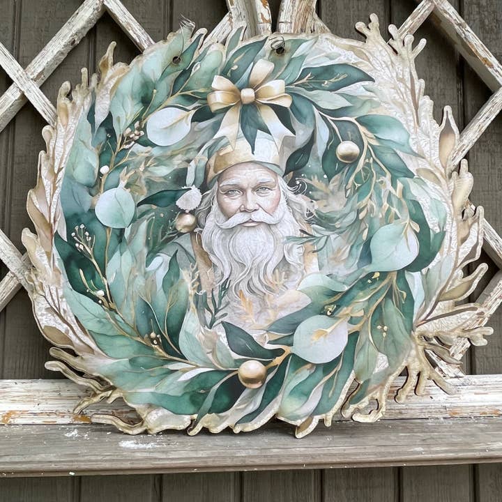 Weihnachtsmann umgeben von grünen und goldenen Blättern Türhänger für den Großhandel von LAND OF COTTON