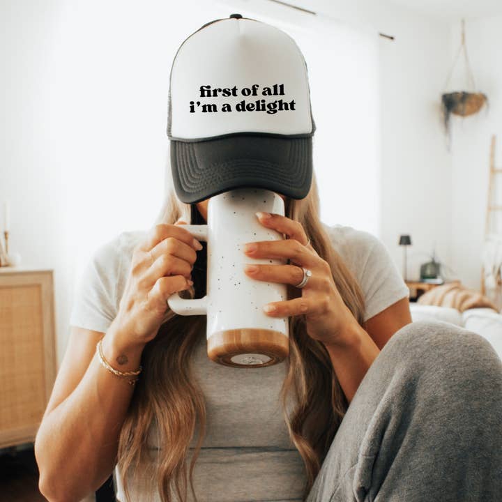 First of All Iβm a Delight Trucker Hat Funny Quote for wholesale by The Boho Haus