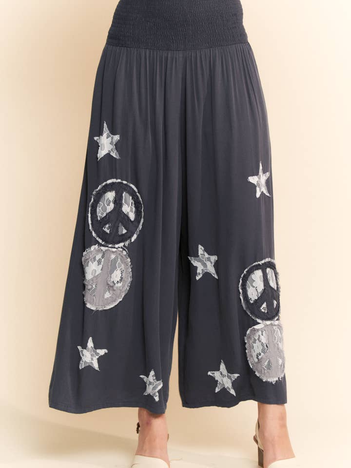 Charcoal PEACE AND STAR PATCHWORK LEG PANTS for wholesale on Faire1