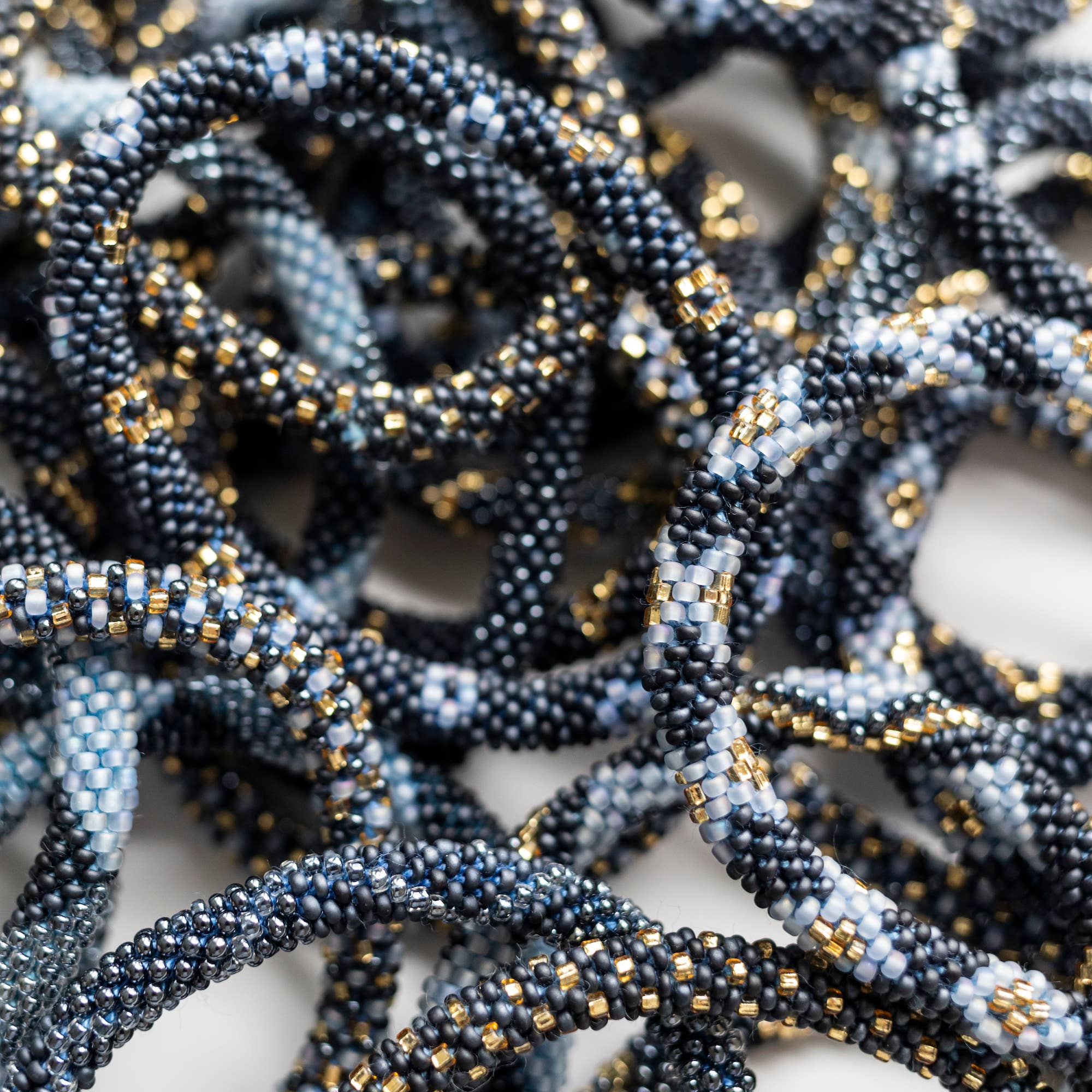 Aid Through Trade - Wholesale Jewelry Set - The Original Roll-On® Bracelet Midnight Blue-Set of 122