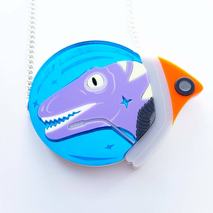 Velociraptor space astronaut necklace for wholesale by designosaur