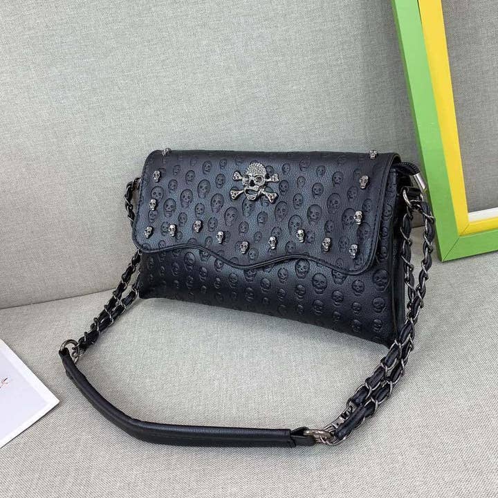 Black Embossed Riveted Skulls Shoulder Bag for wholesale on Faire1