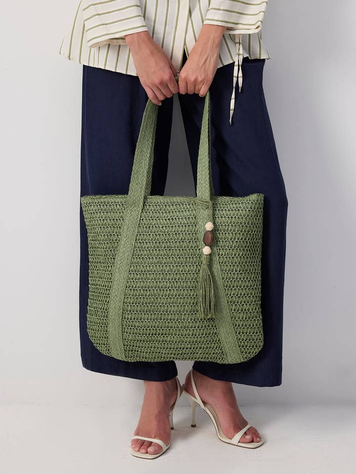 Olive Green Handwoven Straw Tote with Tassel Detail
for wholesale by Touché Privé