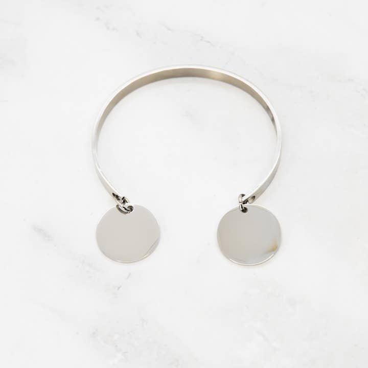 Open bracelet with 2 tassels for wholesale by Angiie