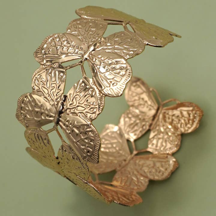 GOLD OPEN CUT BUTTERFLY ADJUSTABLE BANGLE BRACLET | 80B1533 for wholesale on Faire2