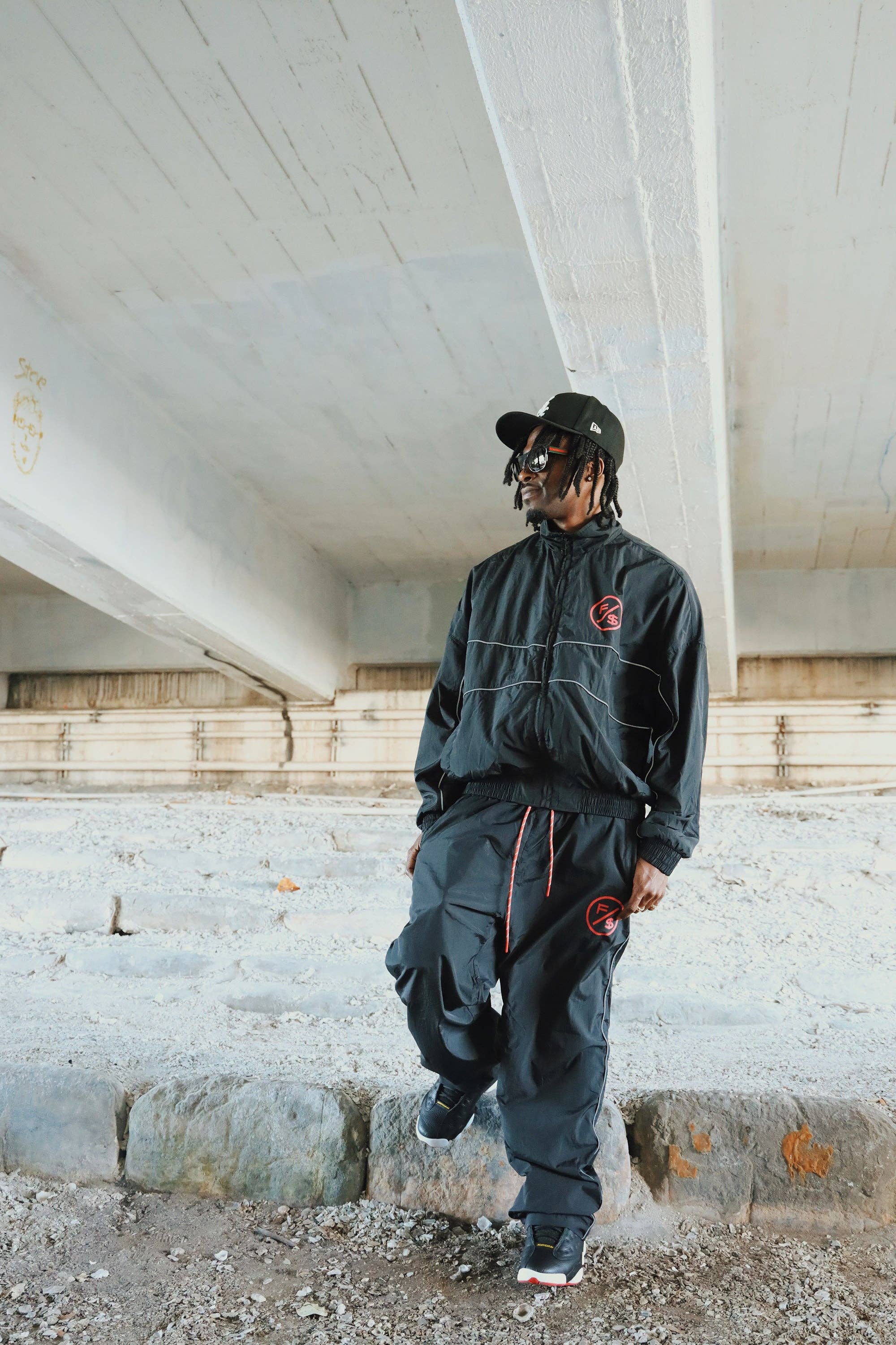 Black Red MOTION Nylon Pants (BRED) for wholesale on Faire3