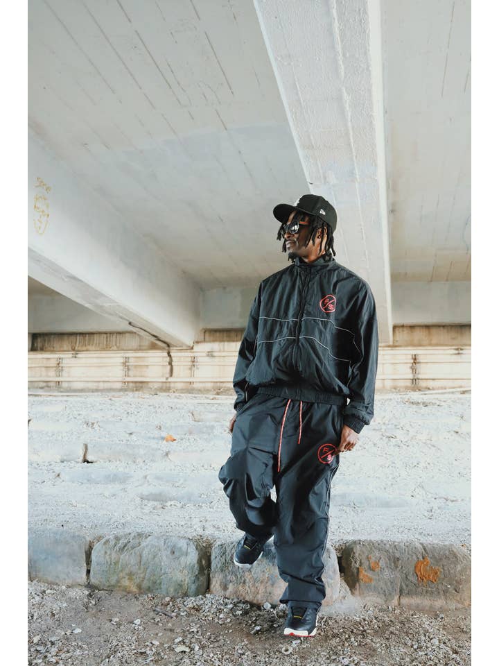 Black Red MOTION Nylon Pants (BRED) for wholesale on Faire3