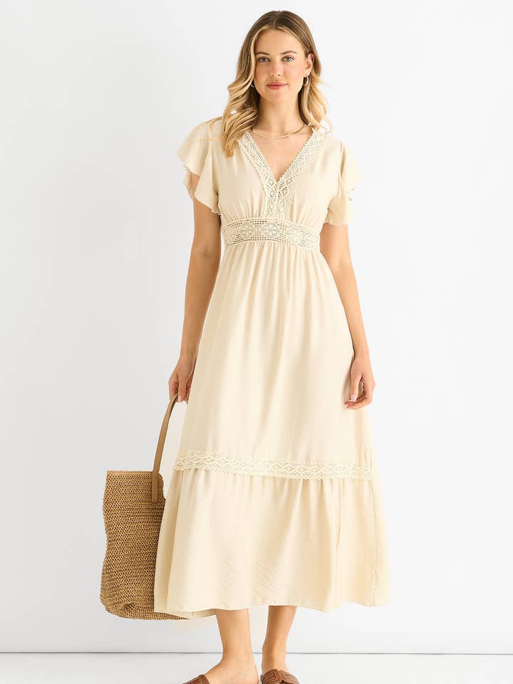 Beige virkad spetsklänning med elastisk midja i midilängd. för wholesale av GINI LONDON