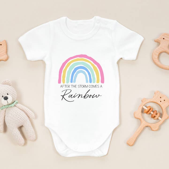 After the storm comes a rainbow onesie for wholesale by Timber Tinkers