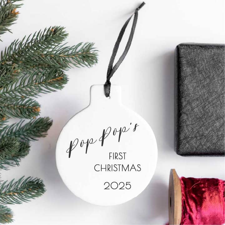 Pop Pop's First Christmas 2025 for wholesale by Girl Holding a Pen