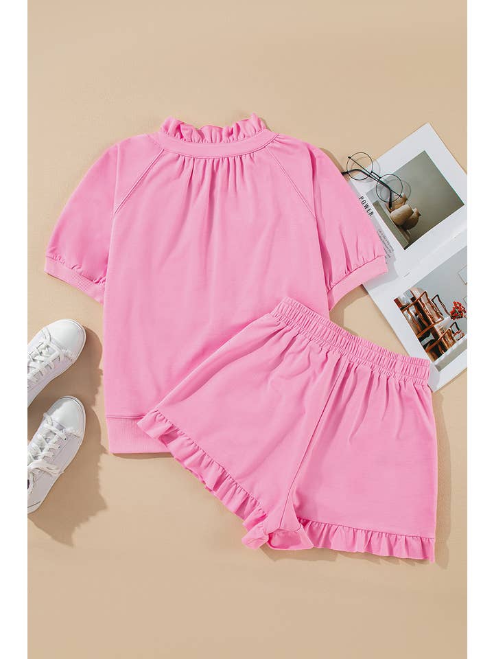 Rose Ensemble haut à manches bouffantes demi-zip et short à volants en vente sur Faire3