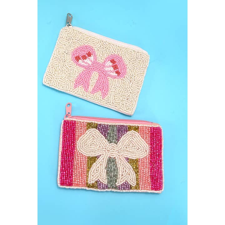 JOSSLYN by wall to wall - Vendita all'ingrosso Portamonete - Donna - SACCHETTO DA VACANZA CON PERLINE BIANCHE ARCOBALENO CON FIOCCO | 91P780