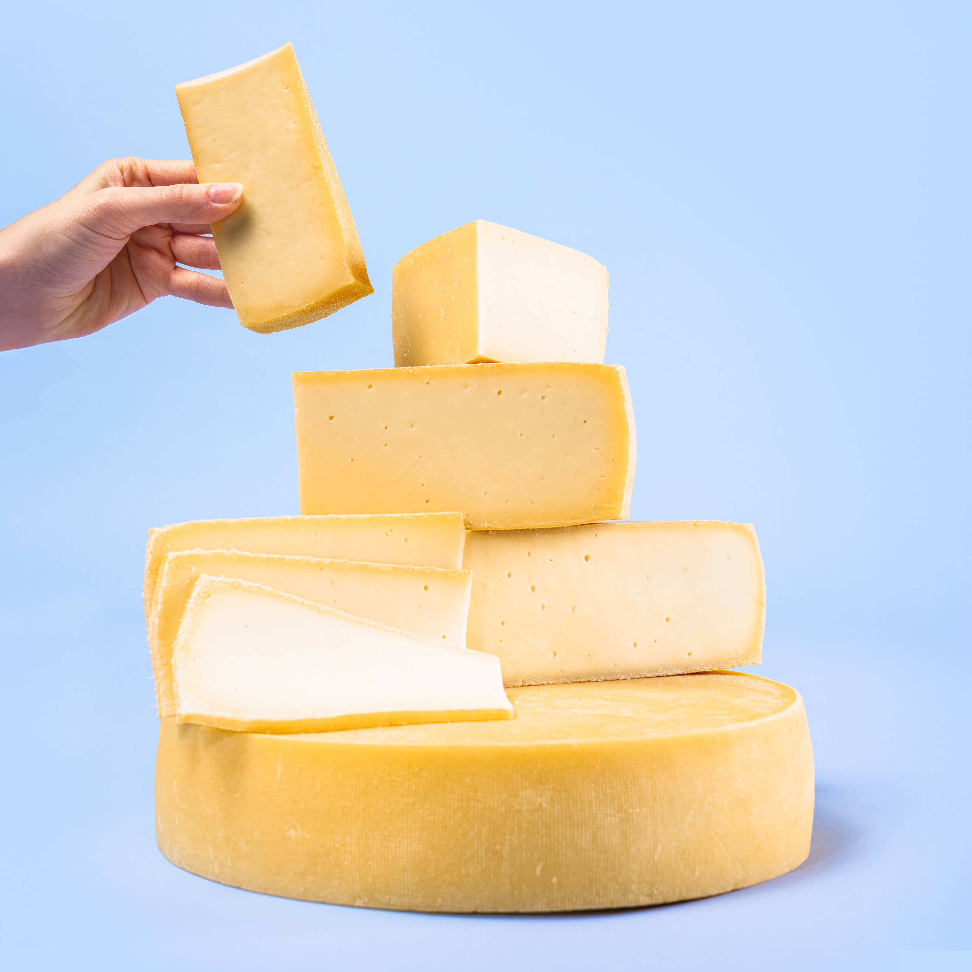 Alpinage Cheese Co. - Wholesale Cheese - Raclette Cheese - 5 Pounds Cut (Half Wheel)1
