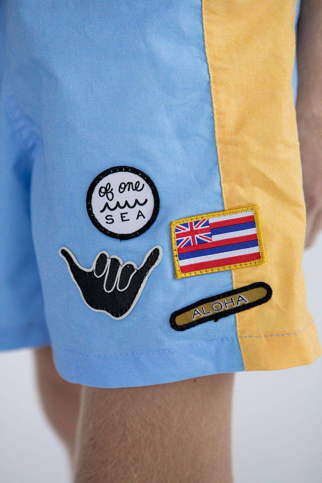 Kid’s Boardshorts in Light Blue and Yellow Colorblock Patch for wholesale on Faire8
