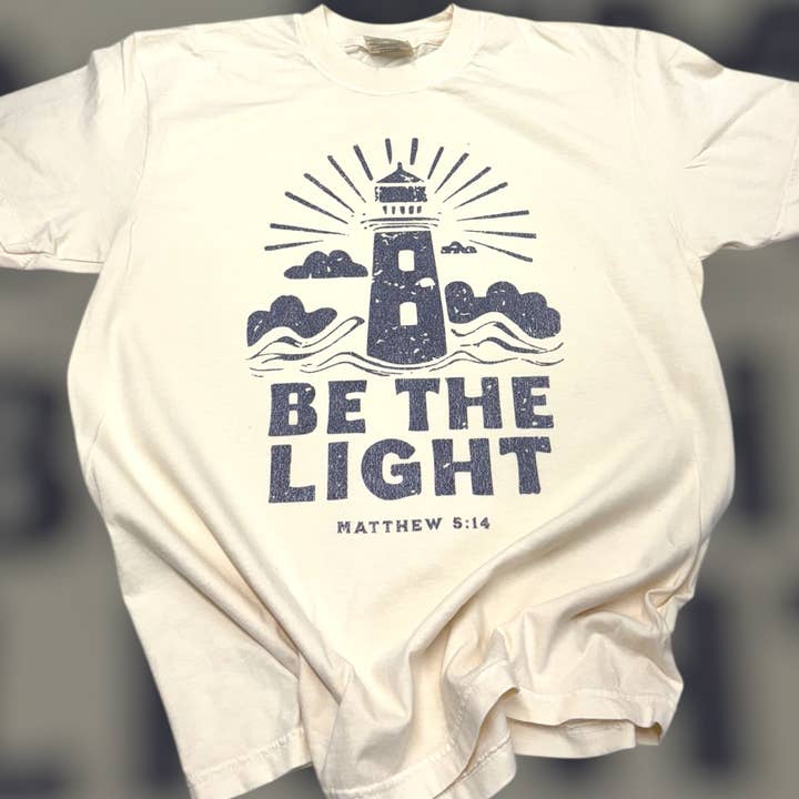 Be The Light Lighthouse Comfort Color T-Shirt  for wholesale by The Lyrical Spirit, LLC
