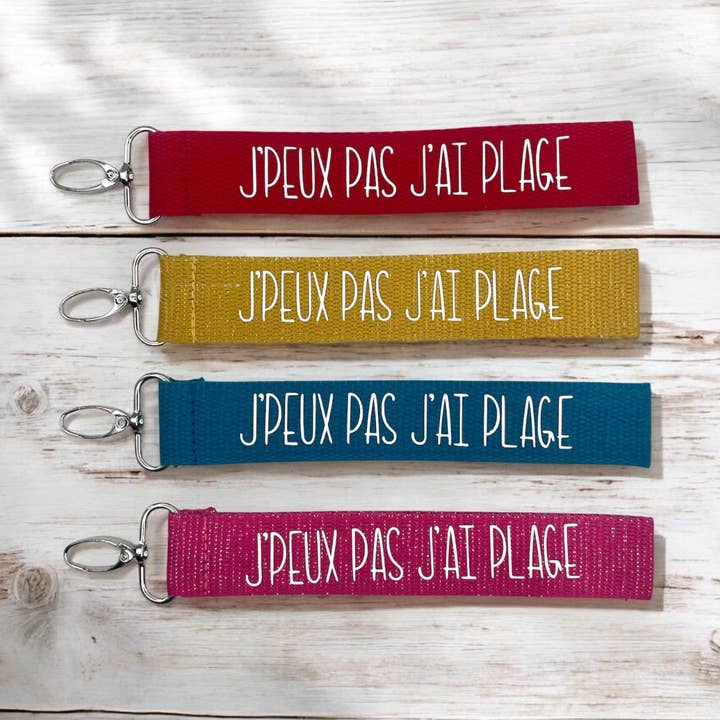 Nøglering med rem, "Jeg kan ikke, jeg er på stranden" for engroshandel hos Emmanuel Création