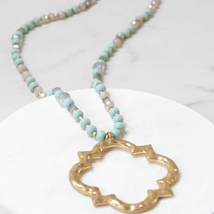 Long Wooden Bead Necklace with Clover Quatrefoil gold pendant - Light turquoise for wholesale by PennyLine inc