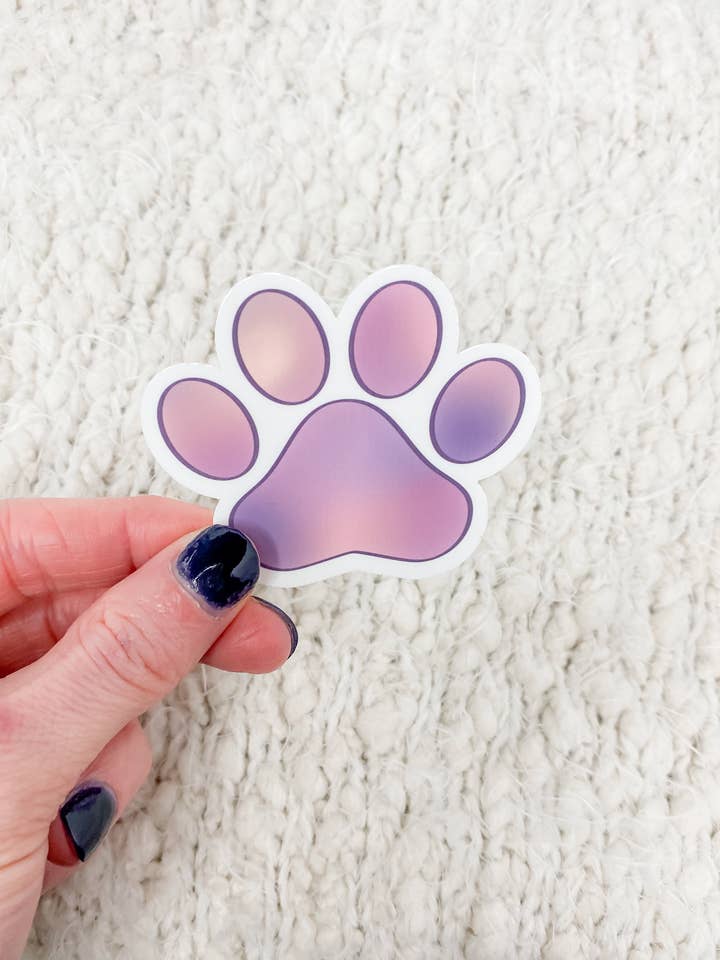 Autocollant violet avec motif de patte de chien pour la vente par Peachy Pup Designs