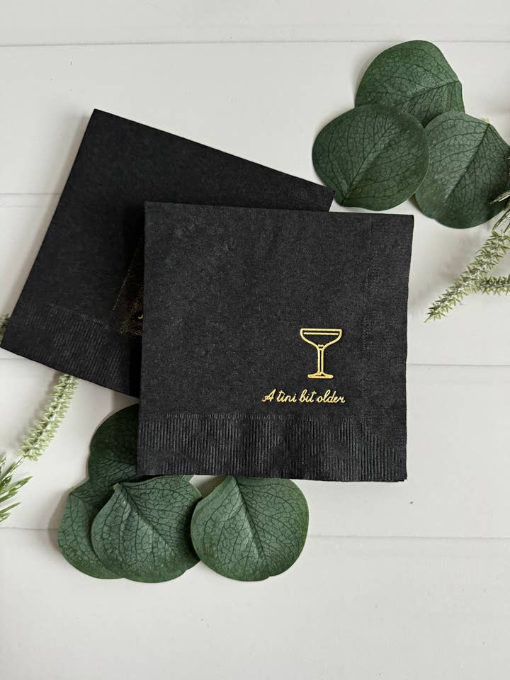 Tini Bit Older Cocktail Napkins - Gold on Black for wholesale by EnFete, LLC